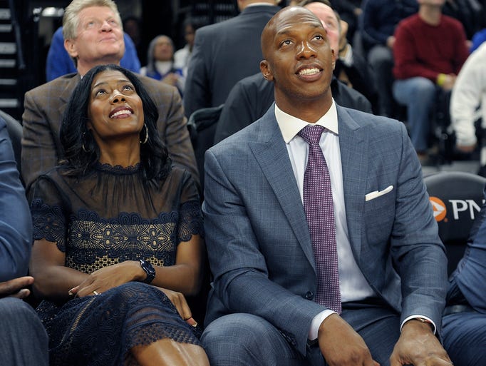 Chauncey Billups and his wife, Piper Billups, looks