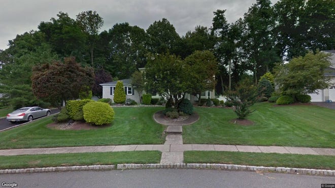 This Google Street View image shows the approximate location of 83 W{dot} Canadian Woods Road in Manalapan. The property at this address changed hands in May 2019, when Ricardo J and Nancy Oliveira  bought the property from Arthur S and Rosemarie Rosen  for $615,000.
