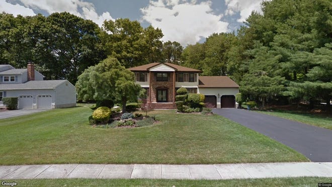 This Google Street View image shows the approximate location of 22 Apache Drive in Manalapan. The property at this address changed hands in April 2019, when Robert and Tara Mack  bought the property from  Khanh Phu and  Ngoc Luong  for $582,000.