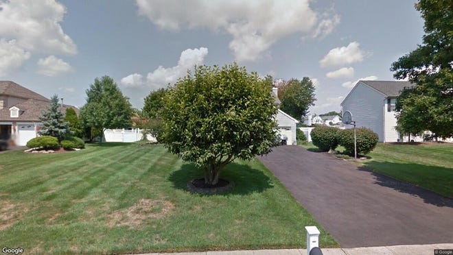This Google Street View image shows the approximate location of 52 Sutton Drive in Manalapan. The property at this address changed hands in May 2019, when Nuno and Filipa Lopes bought the property from Lorraine Valente for $540,000.