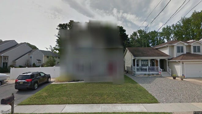 This Google Street View image shows the approximate location of 25 Sandy Point Drive in Brick. The property at this address changed hands in July 2019, when new owners bought the property for $325,000.