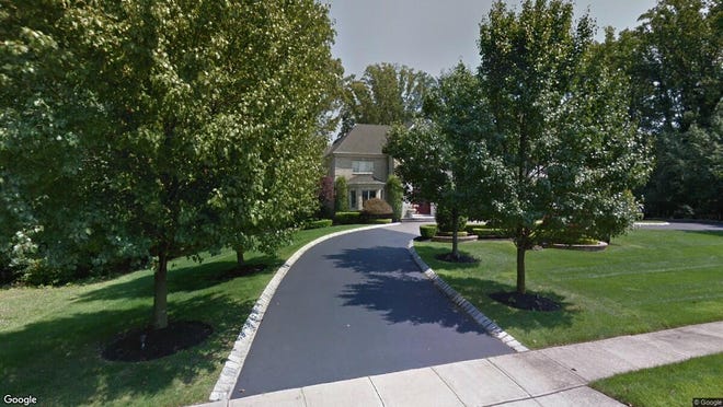 This Google Street View image shows the approximate location of 2 Red Oak Run in Holmdel. The property at this address changed hands in July 2019, when new owners bought the property for $1,350,000.