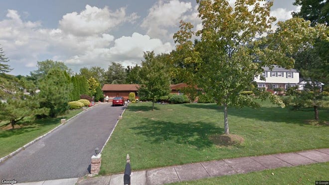 This Google Street View image shows the approximate location of 34 Dayton Lane in Manalapan. The property at this address changed hands in August 2019, when new owners bought the property for $475,000.