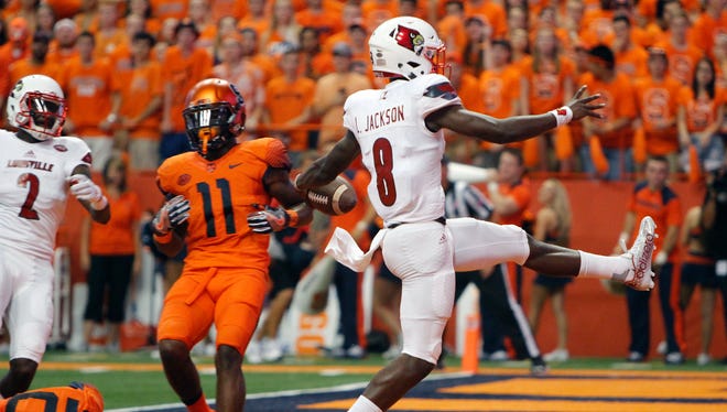 Louisville's Lamar Jackson high-steps into the end zone for a touchdown in the first quarter of an NCAA college football game against Syracuse in Syracuse, N.Y., Friday, Sept. 9, 2016. (AP Photo/Nick Lisi)