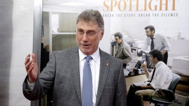 FILE - In this Wednesday, Oct. 28, 2015 file photo, Marty Baron, former editor of The Boston Globe, walks the red carpet as he attends the Boston area premiere of the film "Spotlight" at the Coolidge Corner Theatre, in Brookline, Mass. The film that tells the story of how The Boston Globe reported on the clergy sex abuse scandal. (AP Photo/Steven Senne, File)