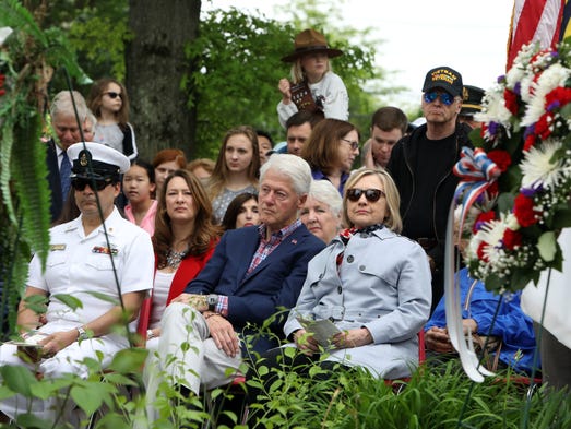Bill and Hillary Clinton attend the Memorial Plaza