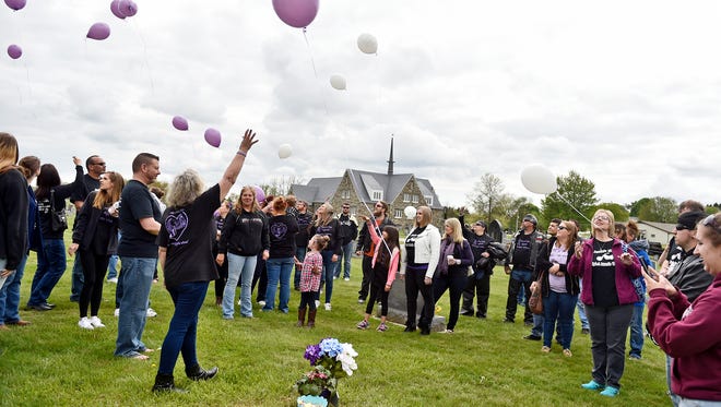 Family and friends of Jessica Mellinger release balloons by her grave Saturday, during the third annual "Jessie's Ride Against Domestic Violence" at Bethlehem Steltz Reformed Church in Codorus Township. Jessica Mellinger, 24, was shot and killed by her boyfriend John R. Snyder in January 2014; Snyder killed himself after a standoff with police shortly thereafter.