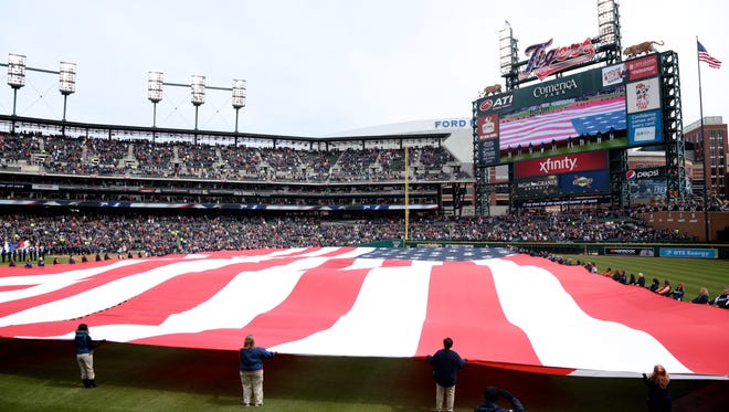 The national anthem before Detroit Tigers play against the New York Yankees during opening day at Comerica Park in downtown Detroit, on Friday, April 8, 2016. 