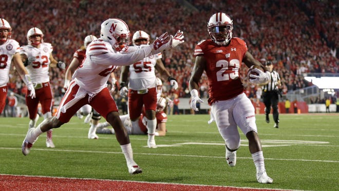 Wisconsin's Dare Ogunbowale runs in for a touchdown in overtime as the Badgers beat  the Nebraska Cornhuskers at Camp Randall Stadium on Saturday night.