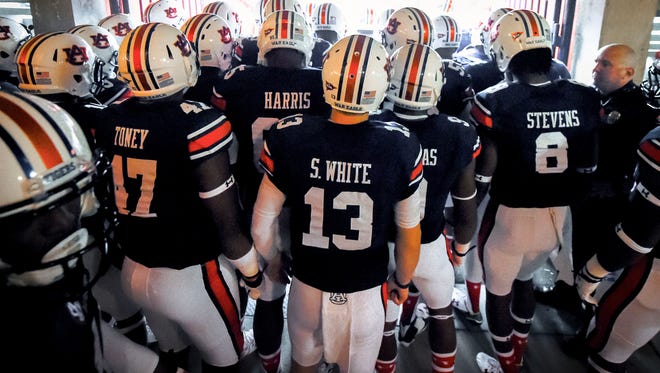 Auburn Tigers quarterback Sean White (13) and his teammates prepare to take the field prior to the game between the Auburn Tigers and the Jacksonville State Gamecocks at Jordan Hare Stadium. Mandatory Credit: Shanna Lockwood-USA TODAY Sports