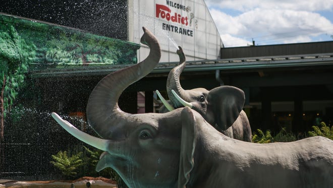 Elephants greet grocery shoppers outside the main "foodies" entrance of Jungle Jim's in Fairfield.
