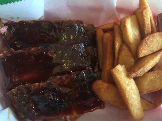 An order of ribs and fries at Smoke-In D’s BBQ.
