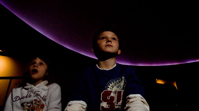 Sycamore Elementary School students Destiny Wade and Andrew Gilmette watch the show at the Schreder Planetarium in 2008. The future of the planetarium is in doubt.