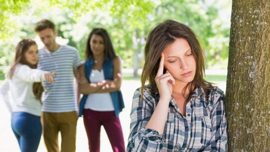 Lonely student being bullied by her peers. (Thinkstock)