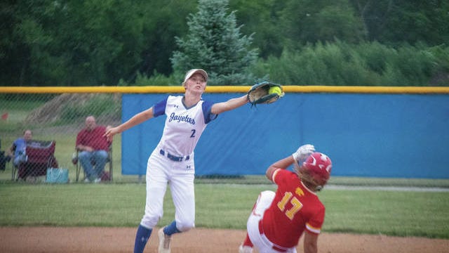 Lydia Olejniczak stretches to catch a ball as a Wildcat runner slides into second on June 29. PHOTO BY SEAN CORDY/THE PERRY CHIEF