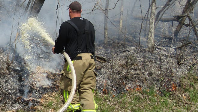 Williamson County Fire and Rescue battle a brush fire on Brush Creek Road in the western part of county.