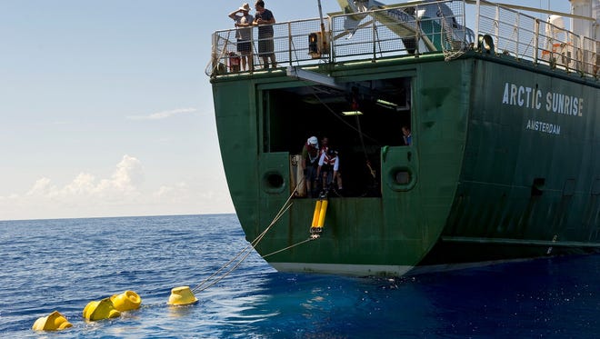 Scientists deploy underwater listening devices from a Greenpeace ship, the Arctic Sunrise, in September 2010. They were collecting data that would help determine the effect of the BP Deepwater Horizon oil spill on deepwater marine mammals in the Gulf of Mexico.