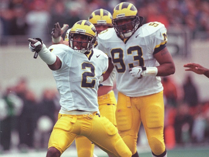 1997: Michigan's Charles Woodson celebrates with his