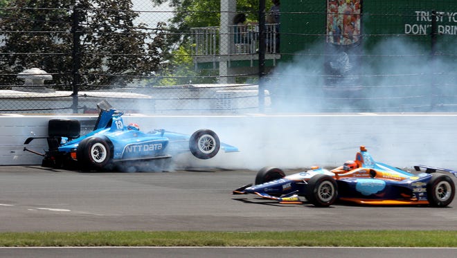 Chip Ganassi Racing IndyCar driver Ed Jones (10) hits the outside of  turn two during the102nd running of the Indianapolis 500 at Indianapolis Motor Speedway on Sunday, May 27, 2018.