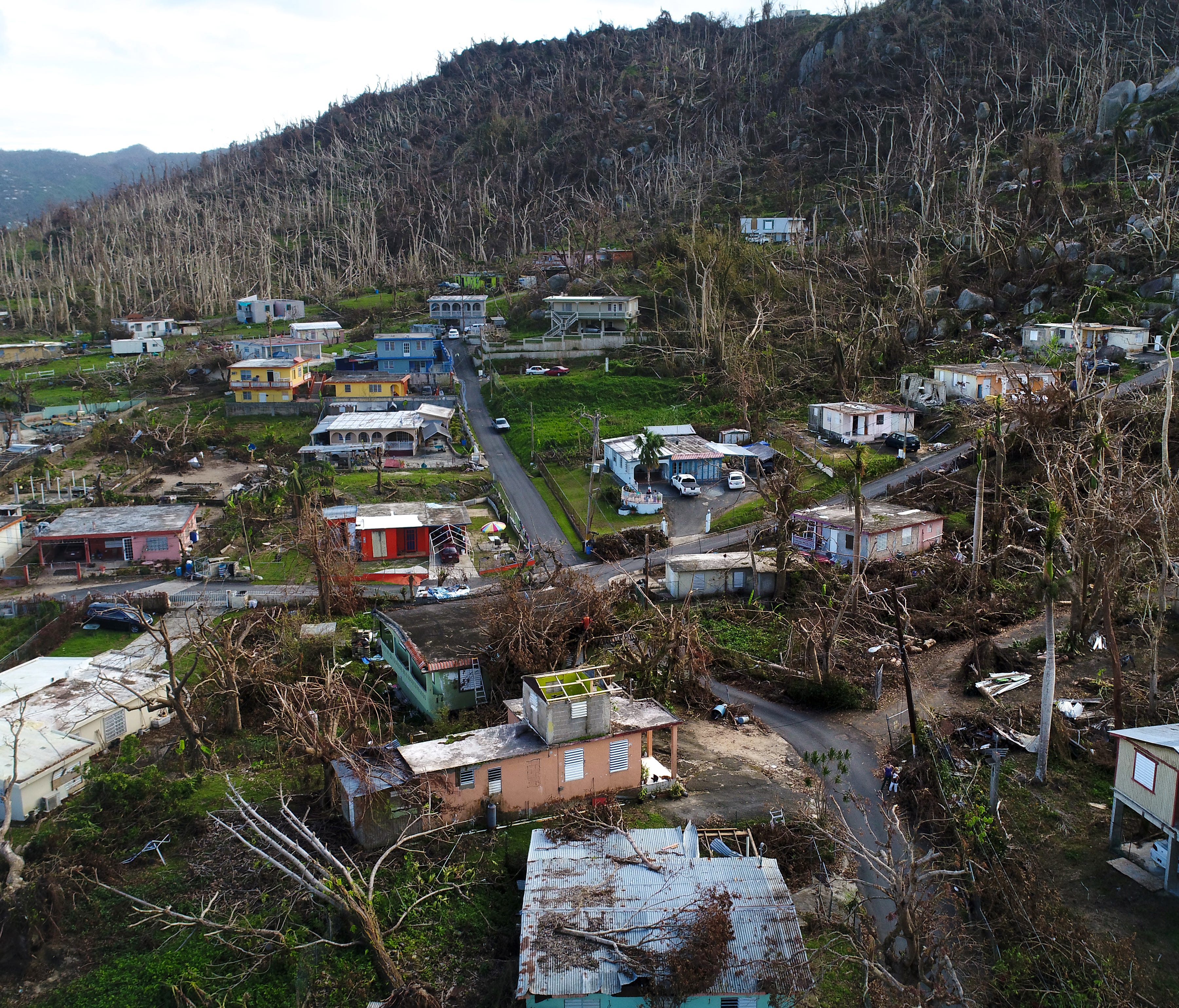 Damaged homes and trees stripped of their leaves are seen throughout Yabucoa, Puerto Rico eleven days after Hurricane Maria struck the island,  Oct. 2, 2017.