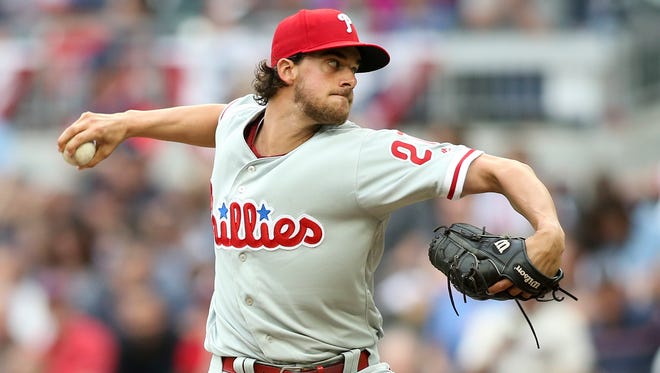 Phillies starting pitcher Aaron Nola (27) throws a pitch against the Atlanta Braves in the first inning at SunTrust Park on Thursday, March 29, 2018, in Atlanta.