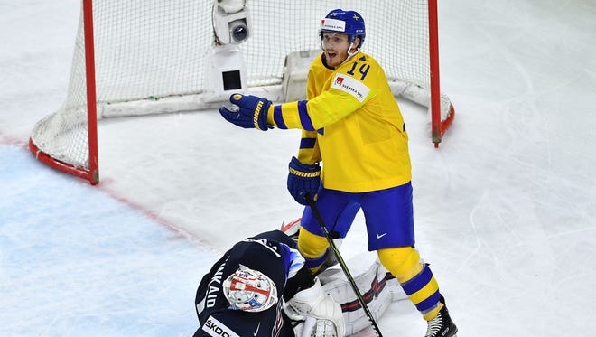 Sweden's Gustav Nyquist, right, vies with United States goalie Keith Kinkaid during the Sweden's 6-0 win in the World Championship semifinal at the Royal Arena in Copenhagen, Denmark, on Saturday, May 19, 2018.