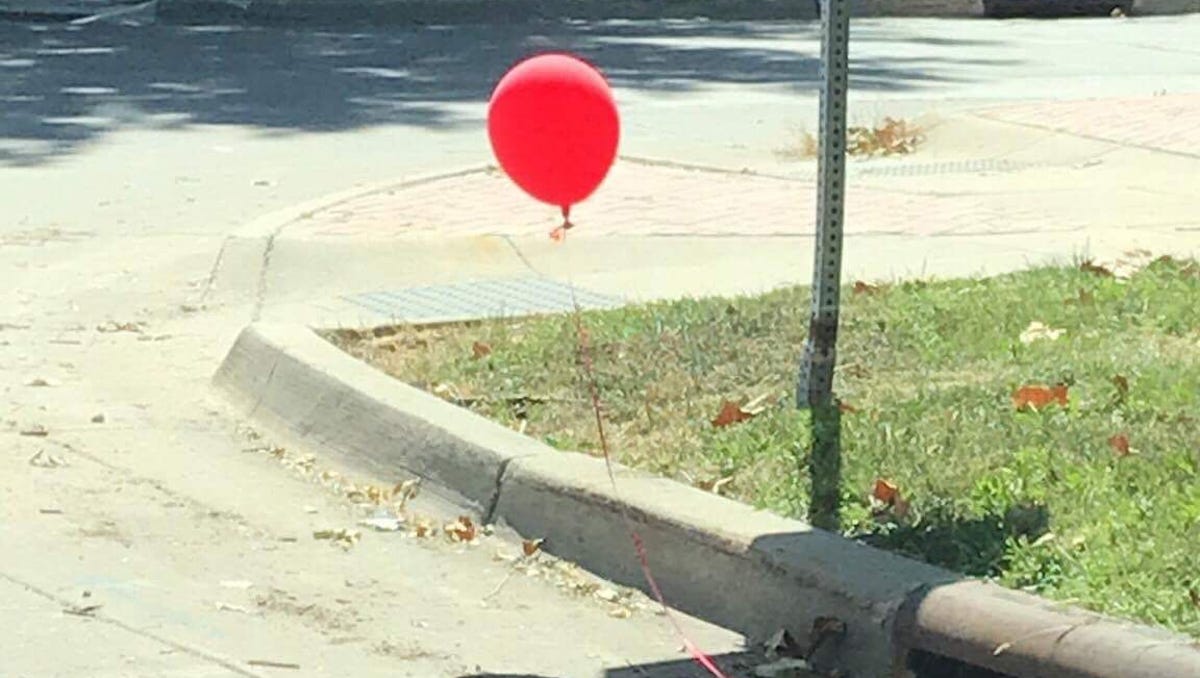It Inspired Red Balloon Tied To Des Moines Sewer Grate