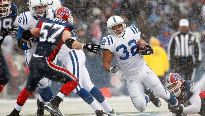 Indianapolis Colts' Mike Hart runs during the second half of the NFL football game against the Buffalo Bills in Orchard Park, N.Y., Sunday, January 3, 2010. Hart returns to his native Syracuse to coach running backs at SU.