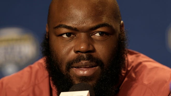 Alabama defensive lineman A'Shawn Robinson speaks during a news conference for the NCAA Cotton Bowl college football game against Michigan State Monday, Dec. 28, 2015, in Dallas. In the age of offense, Alabama could prove that defense can still win championships.