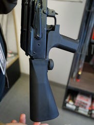 A bump stock device that fits on a semi-automatic rifle