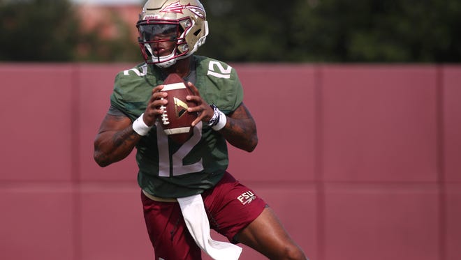 FSU’s Deondre Francois drops back for a pass during their fall practice at the Dunlap Training Facility on Tuesday Aug. 1, 2017. 