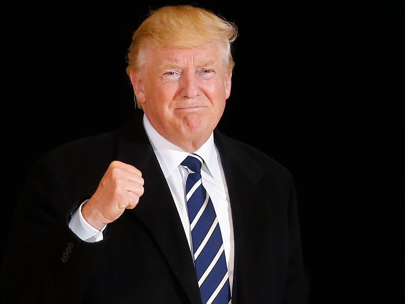 Then Republican presidential candidate Donald Trump takes the stage at a campaign rally at McGrath Amphitheatre in Cedar Rapids, Mich.