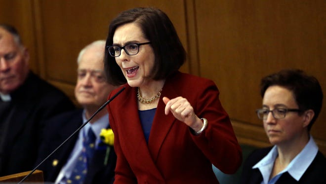 In this Jan. 9, 2017, file photo, Oregon Gov. Kate Brown delivers her inaugural speech in the Capitol House chambers in Salem, Ore. Fueled by anguished voices in the aftermath of the Florida high school shooting,