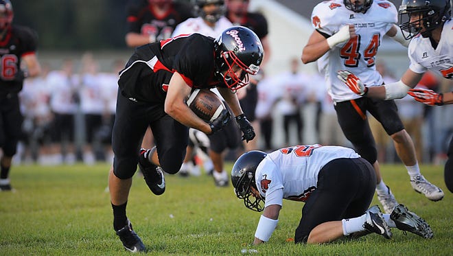 Rocori’s Nicks Skluzacek breaks through a block against St. Cloud Tech on Sept. 11 in Cold Spring. The Spartans open Section 8-4A play at 7 p.m. Tuesday when they host Little Falls.