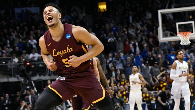 Loyola-Chicago guard Marques Townes (5) celebrates his three-point shot late in the game against Nevada during the second half of a regional semifinal NCAA college basketball game, Thursday, March 22, 2018, in Atlanta. Loyola-Chicago won 69-68.