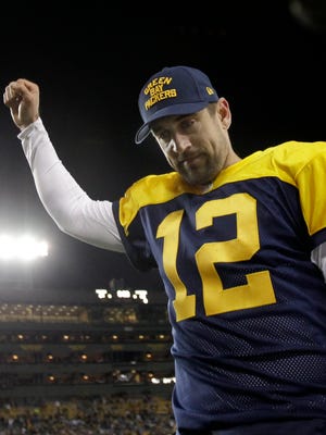 Green Bay Packers quarterback Aaron Rodgers celebrates after the Packers defeated the Chargers 27-20 on Sunday.