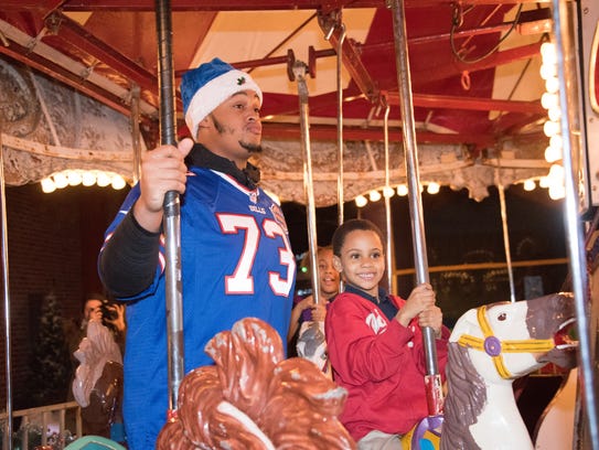 Dion Dawkins takes a spin on the merry-go-round during
