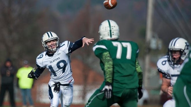 Fair Haven quarterback Ryan Alexander (19) throws the ball during the 2014 Division II championship game against Rice at Rutland High School.