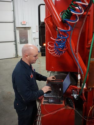 Jason Shreyer runs a diagnostic program on a semi truck at TRP Parts and Service in the Eastpointe Industrial Park in Zanesville.                    