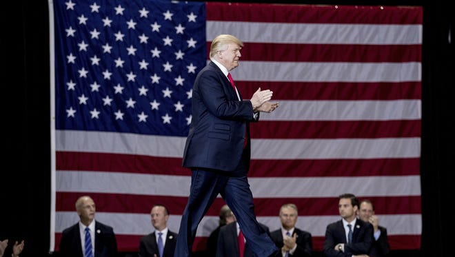 In this March 20 photo, President Trump arrives to speak at a rally at the Kentucky Exposition Center in Louisville.