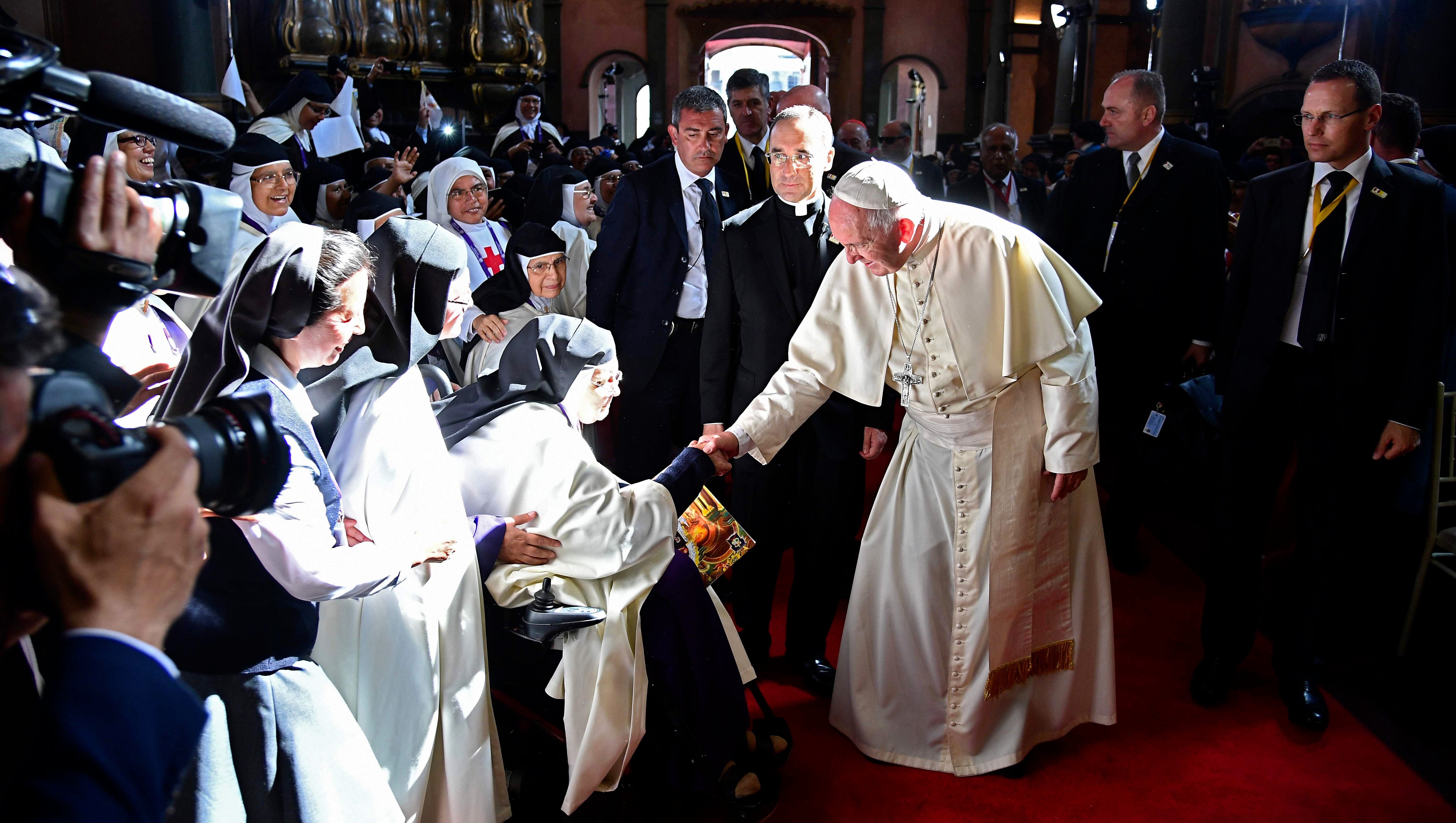 Pope Francis greets nuns as he arrives at the Senor de los Milagros Sanctuary in Lima in January 2018. Pope Francis urged Latin America's faithful to fight rampant violent crime against women including murder, while holding mass in Trujillo, Peru's largest northern city.