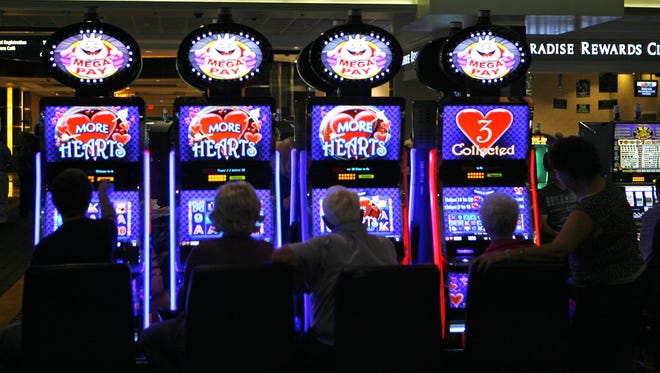 Guests play the slot machines at Agua Caliente Casino Resort Spa in Rancho Mirage at the craps table October 1, 2011.