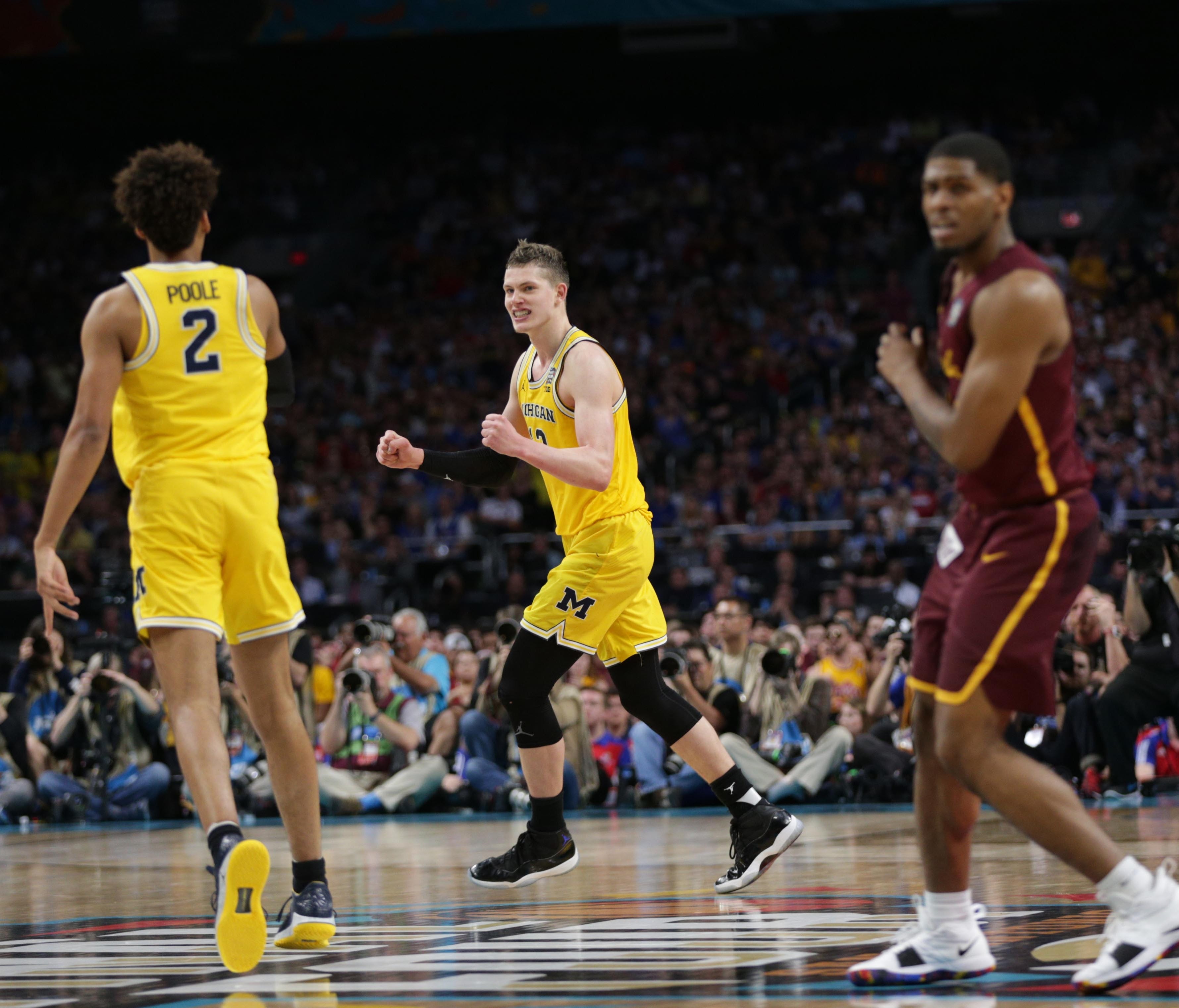 Michigan Wolverines forward Moritz Wagner celebrates.