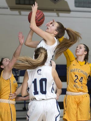 Immaculata sophomore Abby Gilbert (with ball) finished with 18 points and 13 rebounds in the Spartans victory over Watchung Hills on Thursday