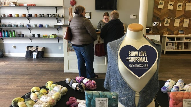 Shoppers explore Yarn Stories in downtown Muncie during Small Business Saturday Nov. 26.