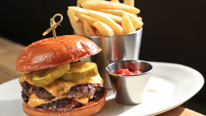 The Fat Lamb's take on cheeseburger and fries has two patties from Paducah, Kentucky's Black Hawk Farms with Duke's Mayo, and horseradish pickles. $16.