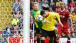Watford's Miguel Britos scores past Liverpool goalkeeper