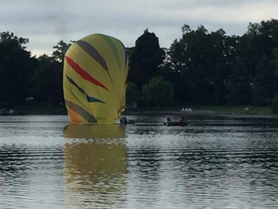 A hot air balloon crashes Thompson Lake after hitting