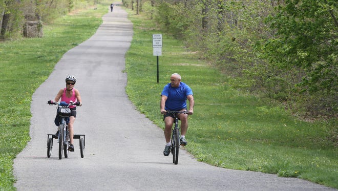 Kathy Lampack and Ralph Pineda bike ride along the Hudson Valley Rail Trail at Tony Williams park in Highland, May 2, 2017. 