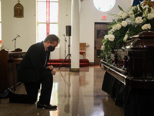 Charles Villaseñor prays before the funeral service for his mother, Lois Villaseñor, at Our Lady of Guadalupe Catholic Church Thursday in East Austin. Lois Villaseñor, who founded Mission Funeral Home in 1959 with her husband, died in July of COVID-19-related complications. She was 87.